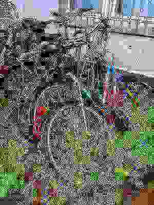 Photo of a bike locked outside, slowly overgrown by weeds. The further down a picture is listed on this page the worse it gets in quality until its content is barely visible.